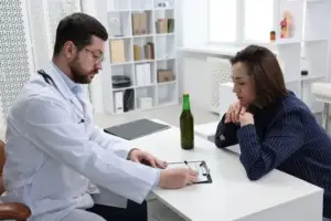Doctor discussing post-detox addiction treatment plan with a patient at a luxury rehab center.