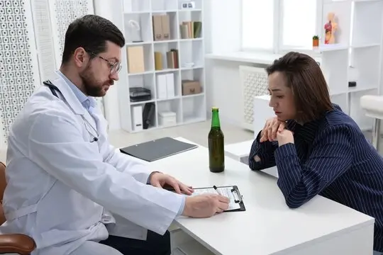 Doctor discussing post-detox addiction treatment plan with a patient at a luxury rehab center.