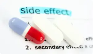 Close-up of Lyrica (pregabalin) pills illustrating potential side effects of the medication