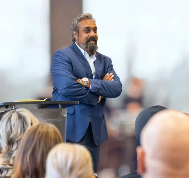 Dr. Ash Bhatt speaking at a professional event as Chief Medical Officer of Legacy Healing Center addiction treatment network